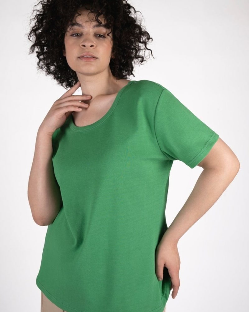 Side of a model wearing a size 0 Reversible Coolest Tee Shirt in Luscious Green by See Rose Go. | dia_product_style_image_id:318940